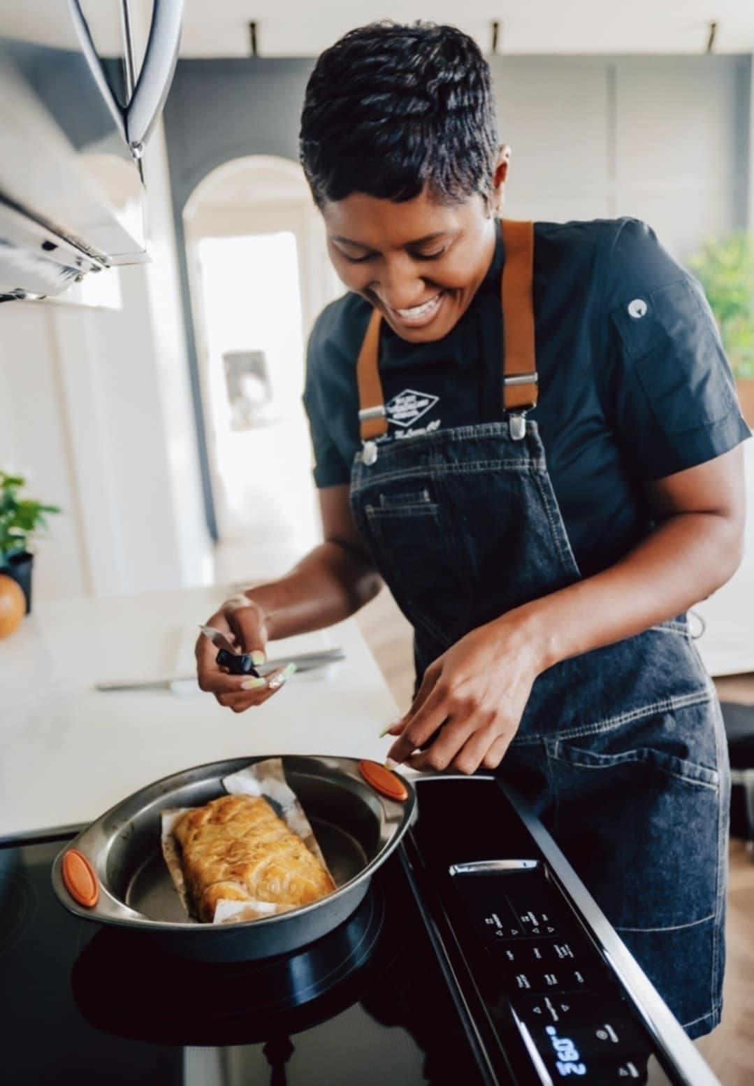 Chef Eboni Darnell Lucas cooking in her kitchen